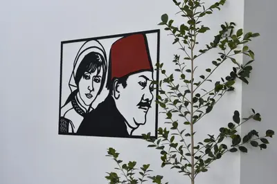 a picture of a man and a woman on a wall at Zoi Ayia Napa in Ayia Napa