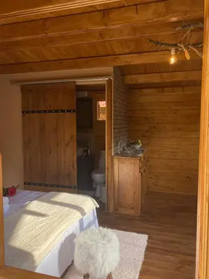 a bedroom with a large bed and a bathroom at Bosco Paradiso in Limassol