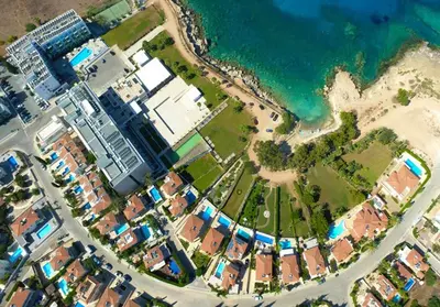 an aerial view of a city next to the ocean at Villa Blue Oasis in Protaras