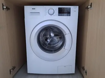 a white washer and dryer sitting in a room at Modern Suite, XL balcony, parking in Nicosia