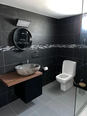 a bathroom with a sink and a toilet at Maria's Apartments 1 in Galata