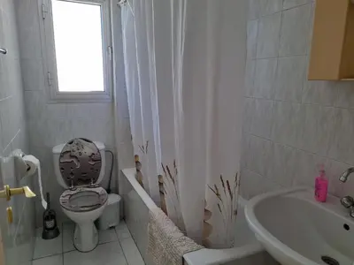 a bathroom with a toilet and a sink at Ikaros Boutique Apartment in Limassol