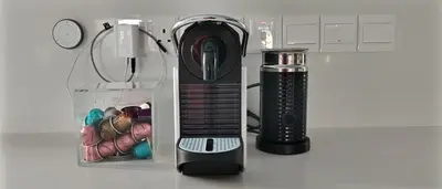 a hair dryer sitting on a counter next to a container at anemelie in Sotira