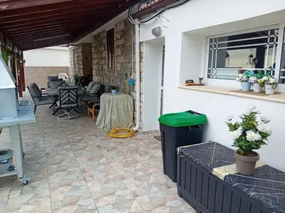 a patio with a table and chairs and a window at Traditional house in pelendri in Limassol