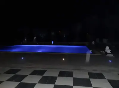 avisor shot of a pool with a checkered floor at The Pervoli Studio - Pool - Close to Beach in Larnaka