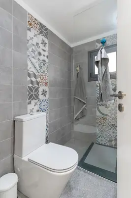 a bathroom with a toilet and a shower at To Hani - Large Traditional House in Nicosia
