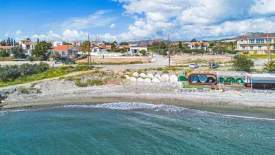 an aerial view of a beach with a body of water at Villa Pacy in Ayios Theodhoros