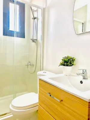 a bathroom with a sink and a toilet and a shower at BALI SUITES 505 in Larnaka