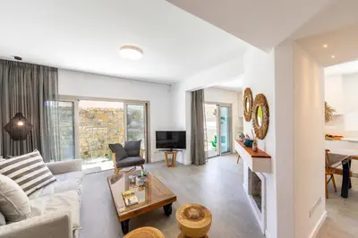 a living room with a couch and a table at Protaras Rose By The Sea Villa in Protaras
