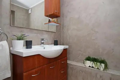 a bathroom with a sink and a mirror at Villa Polina in Ayia Napa