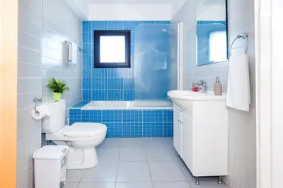 a bathroom with a toilet and a tub and a sink at Villa Abdera - 4bed with Private Pool in Protaras