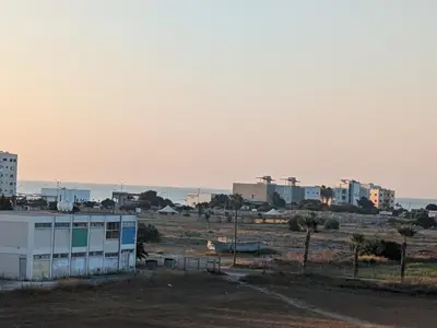 a view of a city with buildings in the distance at Beautiful apartment near beach in Larnaca in Scala