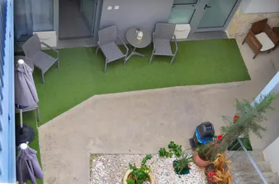 an overhead view of a patio with chairs and a table at St. Lazaros Studios in Larnaka