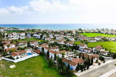arial view of a residential neighborhood with houses and the ocean at Villa Louisa in Ayia Napa