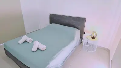 a bedroom with a bed with two slippers on it at STAY Melissa Villa in Protaras