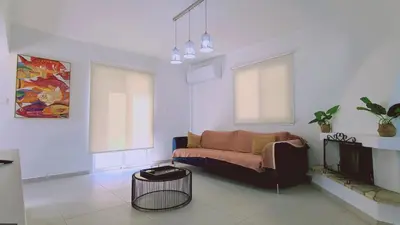 a living room with a couch and a tv at STAY Melissa Villa in Protaras