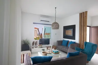 a living room with a couch and a table at Romeo & Juliet in Protaras