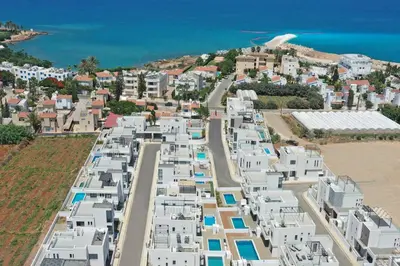 an aerial view of a city with white buildings at Villa Queen Valentina in Protaras