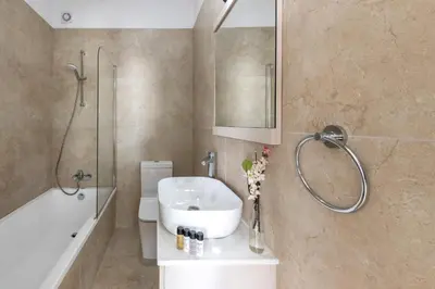 a bathroom with a sink and a shower at Protaras Sol e Mar Villa 1 in Protaras