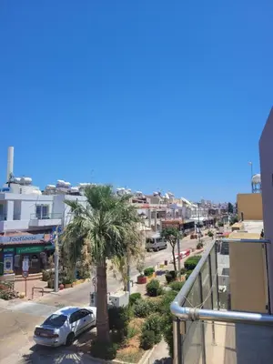 a car parked on a street with a palm tree at Cielo Apartment No2 in Ayia Napa