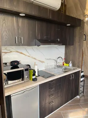 a kitchen with a sink and a microwave at Agros Glamping Boutique in Agros