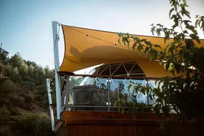 a house with a yellow roof with a large window at Agros Glamping Boutique in Agros