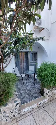a patio with a table and chairs in a building at Stay With Oleg C17 in Paralimni