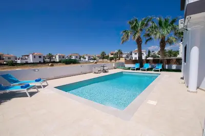 a swimming pool on the roof of a house at Villa suncity Boutique Beachfront in Ayia Napa