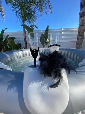 a glass of wine and two wine glasses in a hot tub at Villa Angel - Exotic Villa 200m From Beach in Paralimni