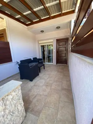 a living room with a couch and a table at Limassol Star 6 in Limassol