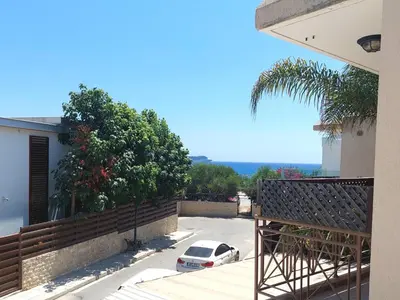 a car parked in a parking lot next to a house at Limassol Star 6 in Limassol