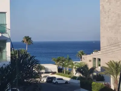 a view of the ocean from a building at Dream Vacation by the Sea Protaras in Protaras