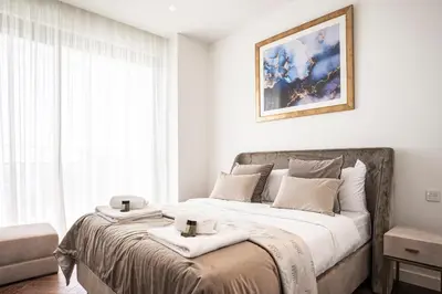 a bedroom with a bed with two towels on it at Del Mar Beachfront 'C' 2 Bedroom Residence in Limassol
