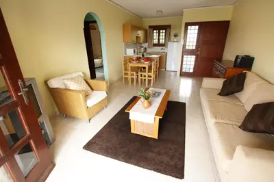 a living room with a couch and a table at Maria Villa in Pissouri