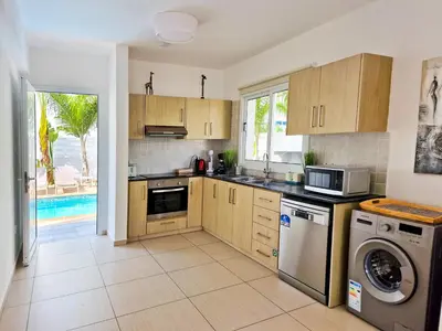 a kitchen with a sink and a dishwasher at Villa Green garden in Ayia Napa