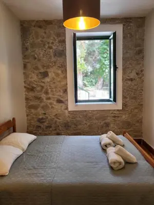 a bedroom with a large bed with towels on it at ThePlatres.Nest in Platres