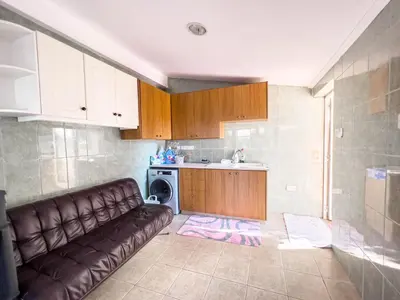 a living room with a couch in a kitchen at FAME villa with Private Pool and Gazebo in Ayia Napa