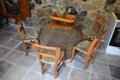 a table and chairs with a pot on top of it at Konatzin tou Massou by Raise in Moutoullas