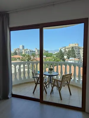 a view of a balcony with a table and chairs at Ευ ζην Central / Ev zen central in Nicosia