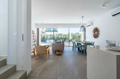 a kitchen and dining room with a table and chairs at Waves 3-Bedroom Villa in Protaras in Paralimni