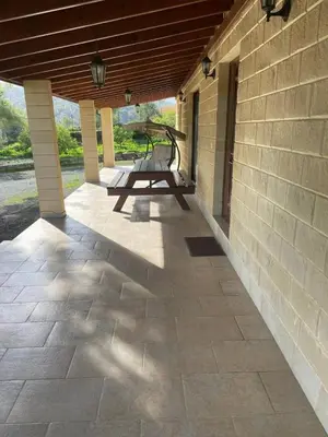 a patio with a picnic table on the side of a building at Stavros Country House in Siá