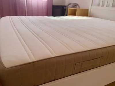 a mattress on a bed frame in a room at TaniAndres apartments in Paralimni