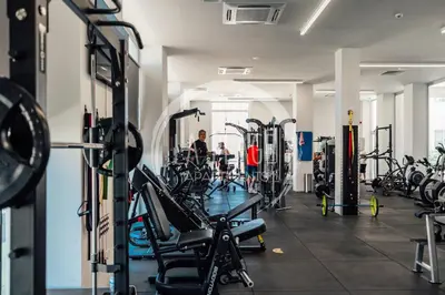 a gym with a lot of treadmills and machines at Lovely 2 Bedroom Family Apartment w/ Pool in Protaras