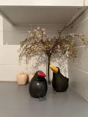 two rubber ducks sitting next to a vase with a plant at APHRODITE 2 Bedroom Apartment Down Town Nicosia in Nicosia
