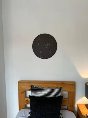 a bedroom with a bed with a black and white pillow at APHRODITE 2 Bedroom Apartment Down Town Nicosia in Nicosia
