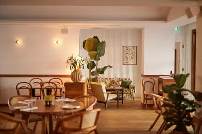 a dining room with tables and chairs and a couch at The Agora Hotel - Small Luxury Hotel of the World - Adults Only in Pano Lefkara