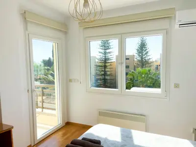 a bedroom with two windows and a bed at Samson Sea Breeze, 3bed sleeps 6, free WiFi in Limassol
