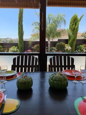 a table with green pumpkins on top of it at LE CAROUBIER splendid 3 bedrooms bungalow in Zanaja