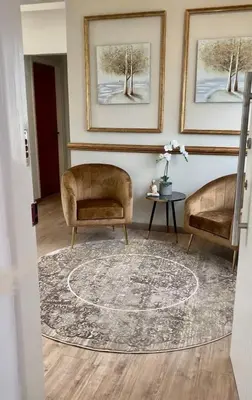 a living room with two chairs and a rug at INCREDIBLE VIEW in Larnaka