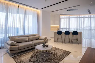 a living room with a couch and a table at 360 Nicosia - 1 bedroom Luxurious Residence in Nicosia
